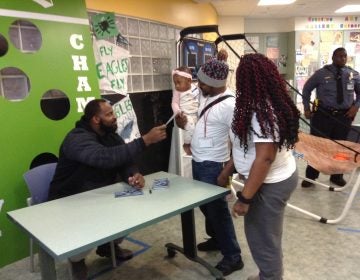 Fletcher Cox signed autographs for children and parents at A.I. DuPont children's hospital. (Zoë Read/WHYY)