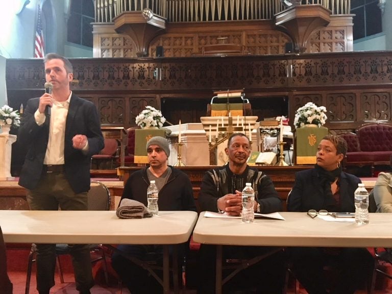 Philadelphia Inquirer columnist Mike Newall, far left, speaks at a community meeting about the prospect of the city hosting a safe-injection site. Seated next to him, left to right, are Gilberto Gonzales, Louis Cain, and City Councilwoman Cindy Bass.
(Darryl Murphy/for WHYY)