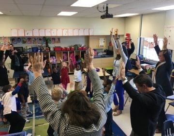 Gov. John Carney takes part in a mindfulness exercise with students at Mt. Pleasant Elementary School in Wilmington. (Mark Eichmann/WHYY)