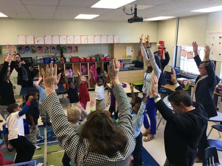 Gov. John Carney takes part in a mindfulness exercise with students at Mt. Pleasant Elementary School in Wilmington. (Mark Eichmann/WHYY)