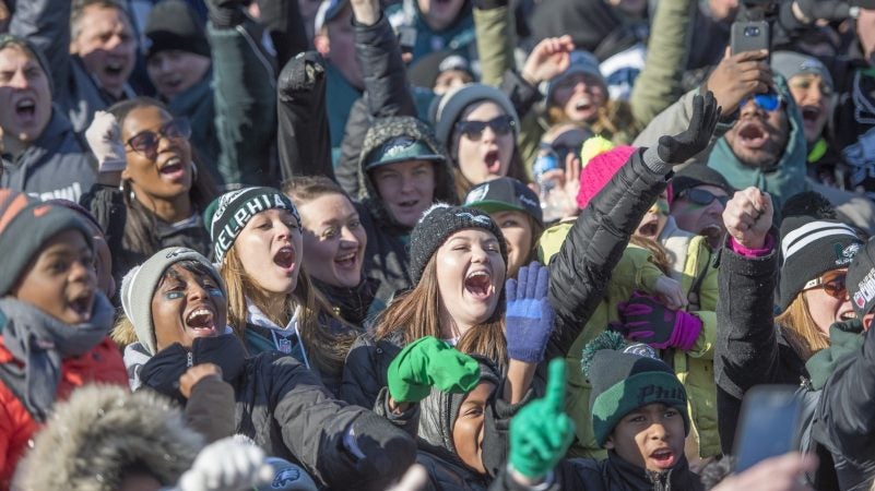 Fans sing the Eagles Fight Song. (Jonathan Wilson for WHYY)