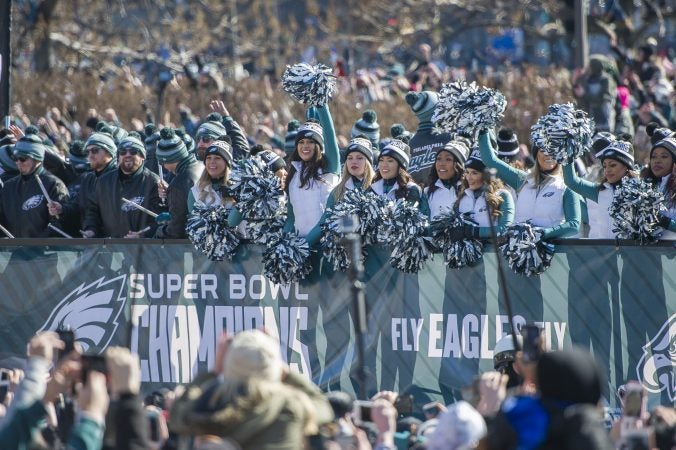 Eagles Cheerleaders wave to the crowd. (Jonathan Wilson for WHYY)