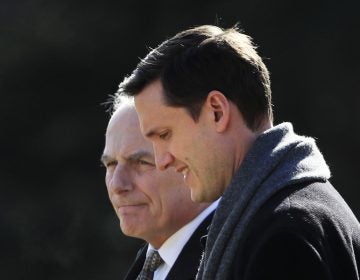 White House staff secretary Rob Porter, foreground, walks with White House Chief of Staff John Kelly, to board Marine One on the South Lawn as they leave the White House on Friday, Feb. 2, 2018.