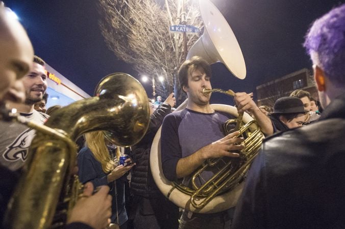 An impromptu brass band performs for Eagles fans at Broad and Kater Streets.