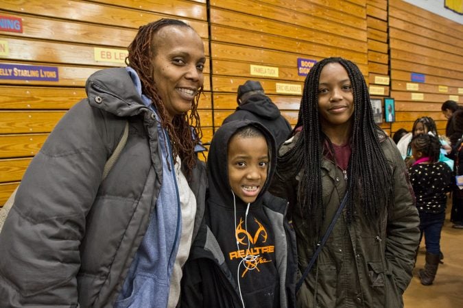 Shonda Copeland, her son Stephen, 9, and daughter Sanyiuah, 13, attend the 26th annual African-American Children’s Book Fair at the Community College of Philadelphia. (Kimberly Paynter/WHYY)