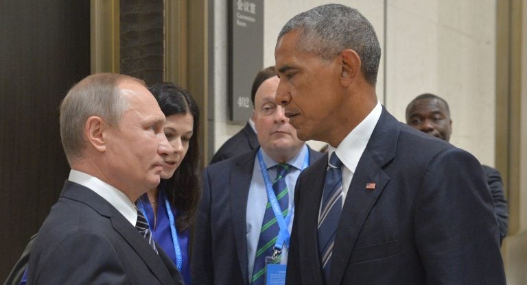 Russian President Vladimir Putin speaks with then-President Barack Obama in Hangzhou, China, on Sept. 5, 2016. Obama's warnings about active measures went unheeded.
(Alexei Druzhinin/AP)