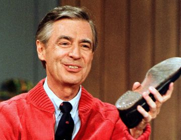 Fred Rogers rehearses the opening of his PBS show Mister Rogers' Neighborhood, which premiered Feb. 19, 1968. Gene J. Puskar/AP