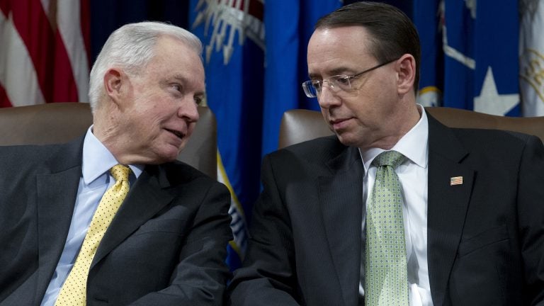 Attorney General Jeff Sessions speaks with Deputy Attorney General Rod Rosenstein at an event at the Department of Justice in Washington, D.C. on Feb. 2, 2018. (Jose Luis Mag/AP)