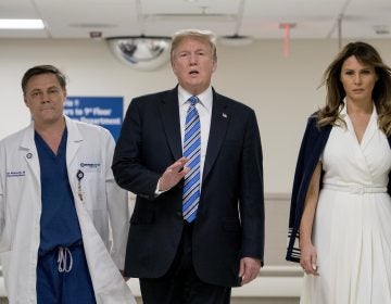 President Trump, accompanied by first lady Melania Trump, right, and Dr. Igor Nichiporenko, speaks to reporters while visiting medical staff at Broward Health North in Pompano Beach, Fla., on Friday.