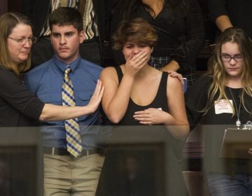 High school students from Parkland, Fla., where a young man gunned down 17 people, react as the state's House of Representatives voted not to hear a bill banning assault rifles. (Mark Wallheiser/AP) 