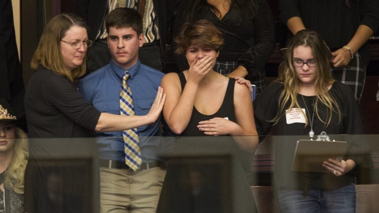 High school students from Parkland, Fla., where a young man gunned down 17 people, react as the state's House of Representatives voted not to hear a bill banning assault rifles. (Mark Wallheiser/AP) 