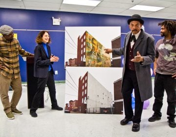 Artist Willis Nomo Humphrey, Executive Director of Mural Arts, Jane Golden, Octavius Catto re-enactor Bob Branch, and artist Keir Johnston unveil the mural honoring Octavius Catto to be installed at the Universal Institute Charter School on Catherine Street.(Kimberly Paynter/WHYY)