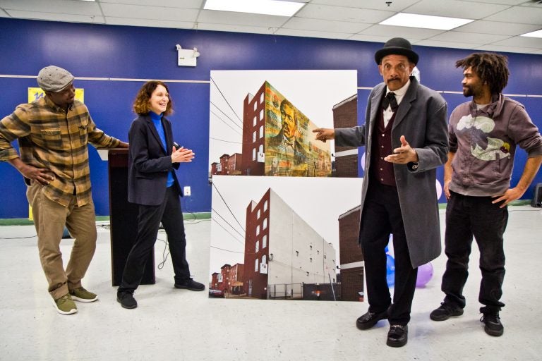 Artist Willis Nomo Humphrey, Executive Director of Mural Arts, Jane Golden, Octavius Catto re-enactor Bob Branch, and artist Keir Johnston unveil the mural honoring Octavius Catto to be installed at the Universal Institute Charter School on Catherine Street.(Kimberly Paynter/WHYY)