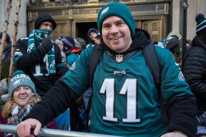 Travis Casey, 34, flew in from Washington state, arriving at City Hall at 4am to scout the perfect spot to cheer on his winning Eagles. (Emily Cohen for WHYY)