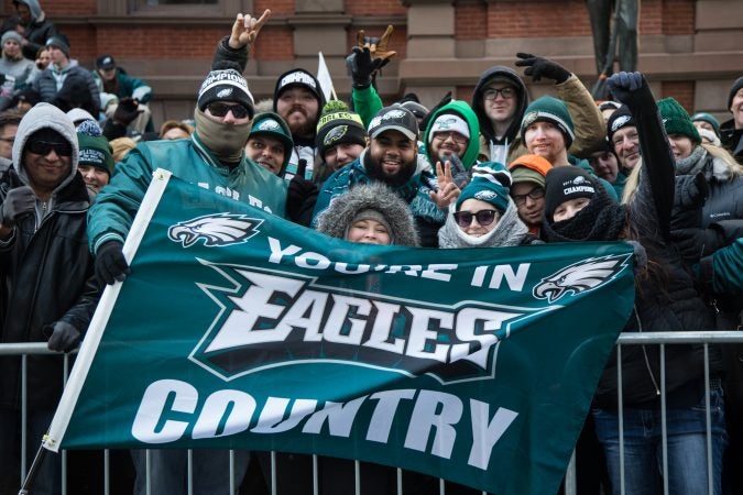 Friends from North Philadelphia faced the cold since 5:30 a.m. to get the best spot they could for the Eagles Super Bowl Champions parade in Philadelphia February 8th 2018. (Emily Cohen for WHYY)