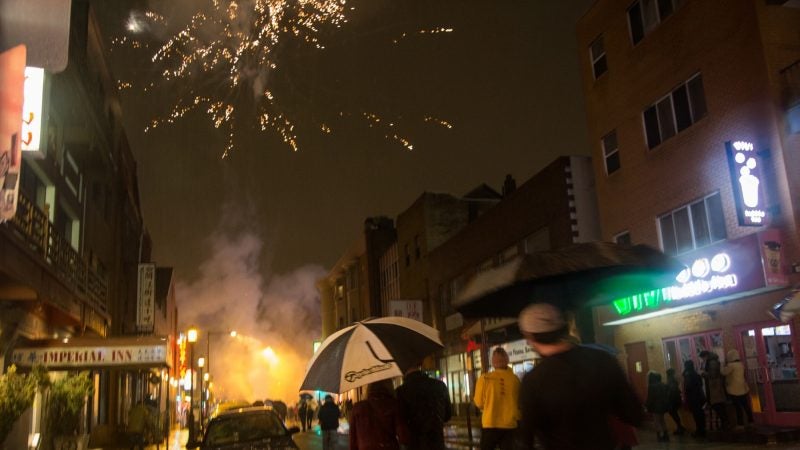 Fireworks are set off in celebration of the Chinese New Year in Phildelphia's Chinatown on February 15, 2018. (Emily Cohen for WHYY)