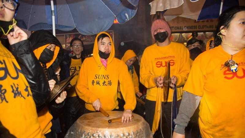 A drummer keeps the beat for the lions as they dance to celebrate the Chinese New Year in Phildelphia's Chinatown on February 15, 2018. (Emily Cohen for WHYY)