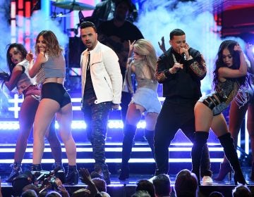 Luis Fonsi and Daddy Yankee, performing with female dancers during this year's Grammy telecast, is a topic on this week's show. (Kevin Winter/Getty Images for NARAS)