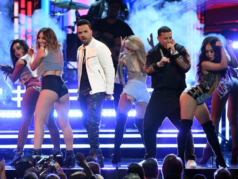 Luis Fonsi and Daddy Yankee, performing with female dancers during this year's Grammy telecast, is a topic on this week's show. (Kevin Winter/Getty Images for NARAS)