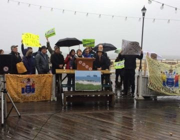 Environmentalists gather on Asbury Park's boardwalk to speak out against the Trump administration plan for expanded offshore drilling. (Phil Gregory/WHYY)