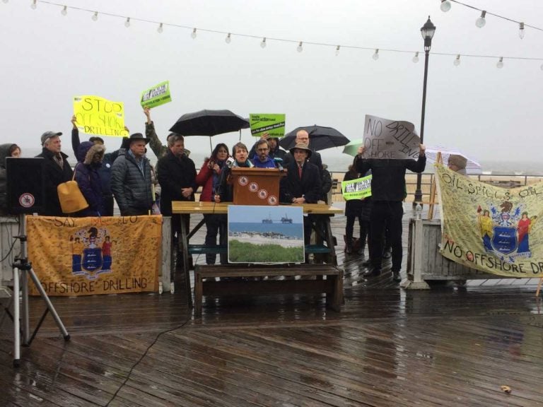 Environmentalists gather on Asbury Park's boardwalk to speak out against the Trump administration plan for expanded offshore drilling. (Phil Gregory/WHYY)