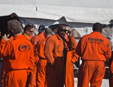 Refinery workers at Philadelphia Energy Solutions wait to hear Republican Senator Ted Cruz speak at a rally against the Renewable Fuel Standards. The company blames the program for its financial troubles in a recent bankruptcy filing.(Kimberly Paynter/WHYY)