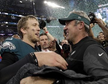 Philadelphia Eagles' Nick Foles celebrates with head coach Doug Pederson after winning Super Bowl LII against the New England Patriots .