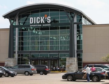 Customers shop at a Dick's Sporting Goods store in Niles, Ill., in 2014. The sports retailer CEO Ed Stack announced Dick's is immediately ending its sales of assault-style rifles and requiring all customers to be older than 21 to buy a firearm at its sto