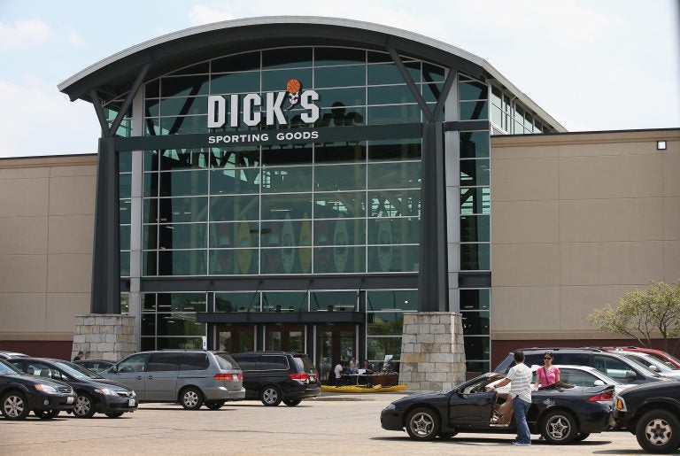 Customers shop at a Dick's Sporting Goods store in Niles, Ill., in 2014. The sports retailer CEO Ed Stack announced Dick's is immediately ending its sales of assault-style rifles and requiring all customers to be older than 21 to buy a firearm at its sto