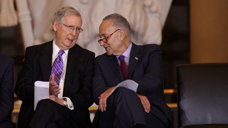 U.S. Senate Majority Leader Sen. Mitch McConnell, R-Ky., (left), chats with Senate Minority Leader Sen. Chuck Schumer, D-NY, (right), at a congressional event in October 2017. (Alex Wong/Getty Images) 