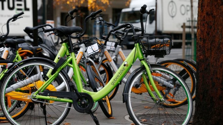 A Gobee bike sits near other bikeshare rental options in Paris on Nov. 18, 2017. (Geoffroy Van Der Hasselt/AFP/Getty Images)