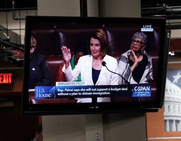 A TV in the Capitol shows House Minority Leader Nancy Pelosi, D-Calif., giving a speech on the House floor Wednesday. Pelosi has been speaking for more than seven hours as a protest because negotiations over the future of the expiring Deferred Action for Childhood Arrivals program have stalled.