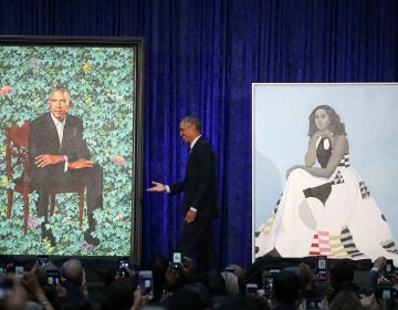 Former U.S. President Barack Obama stands with his and former first lady Michelle Obama's newly unveiled portrait during a ceremony at the Smithsonian's National Portrait Gallery (Mark Wilson/Getty Images)