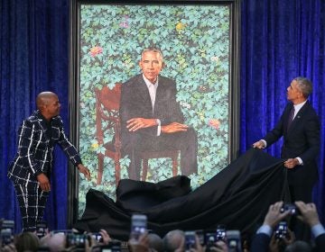 Former President Barack Obama (right) and artist Kehinde Wiley unveil his portrait during a ceremony at the Smithsonian's National Portrait Gallery. (Mark Wilson/Getty Images) 