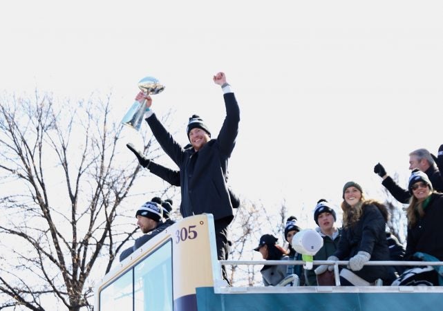 Eagles Quarterbacks Carson Wentz with Nick Foles with the Vince Lombardi trophy at the Philadelphia Eagles Super Bowl Championship parade on Feb. 8, 2018. (Lindsay Lazarski/WHYY)