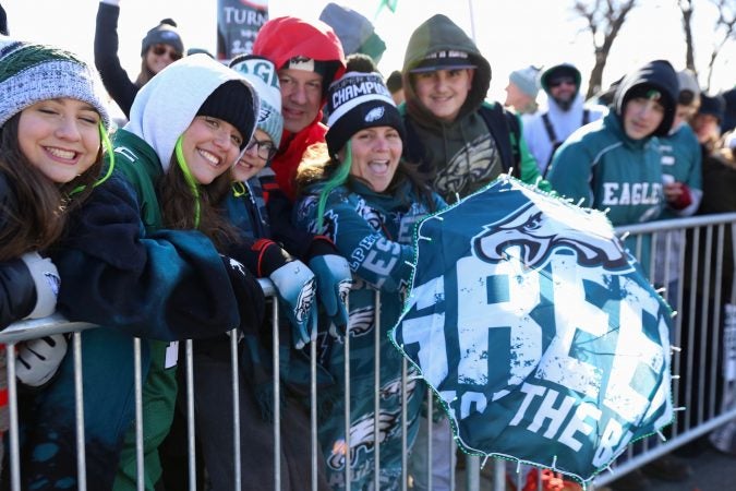 Fans from South Philadelphia beem with pride and a “singing” umbrella as the wait that plays the Eagles fight song.