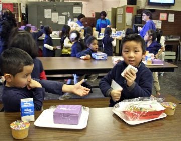 Children at Southwark School eat their school lunches from styrofoam trays, Dec. 20, 2016.