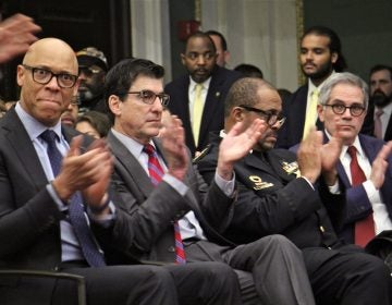 Top administrators (from left) schools Superintendent William Hite, Managing Director Michael DiBerardinis, Sheriff Jewel Williams, and District Attorney Larry Krasner, applaud during Mayor Jim Kenney's budget address. (Emma Lee/WHYY)