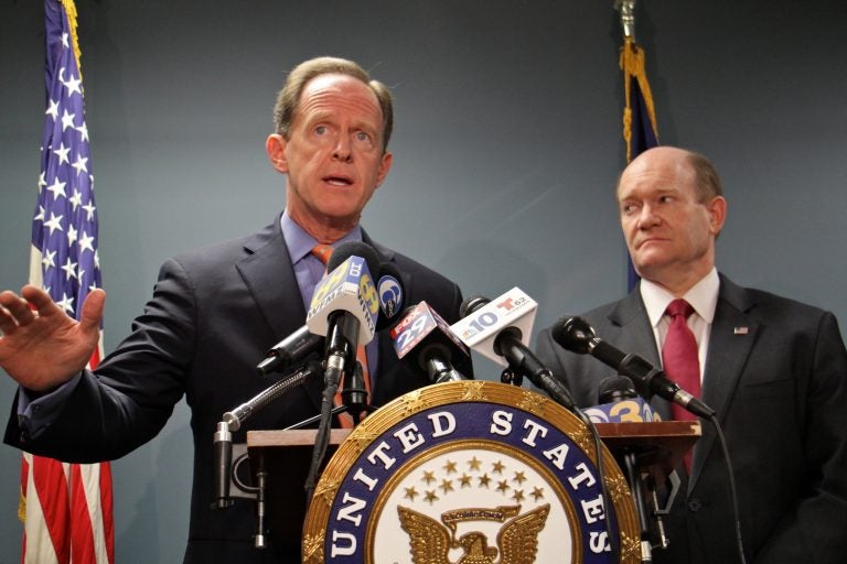 U.S. Senators Pat Toomey and Chris Coons announce their gun legislation in Philadelphia, March 5, 2018. (Emma Lee/WHYY)