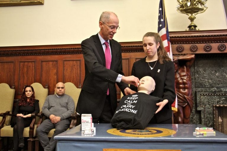 Philadelphia Health Commissioner Thomas Farley demonstrates the use of naloxone spray during a press conference at City Hall.