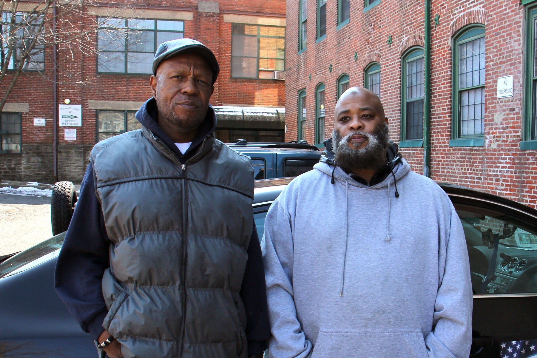 Brothers Tony Pointer (left) and Leroy Prince live in the Hamill Mill II apartments. Prince says he has to heat water on his stove for bathing. (