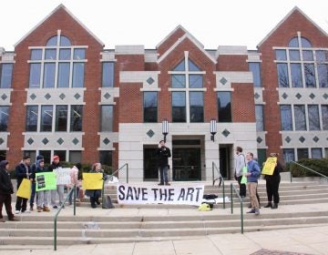 About 20 people turned out for a protest in front of La Salle University's Connelly Library. They object to the decision by the university's board of trustees to sell 46 works of art to pay for educational programs.