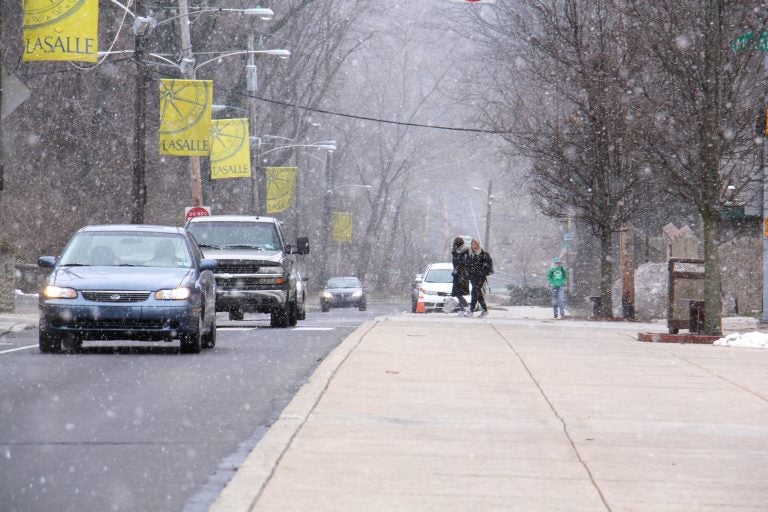 Snow falls on the La Salle University campus in Philadelphia. (Emma Lee/WHYY)