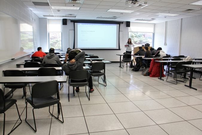 Ann Draemel teaches 10 students in a college level English course for international students at Temple University. Demand for the course has dropped along with international enrollment. (Emma Lee/WHYY)