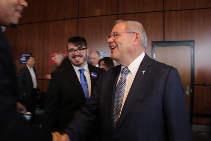 Sen Bob Menendez shakes hands with constituents during a re-election campaign with a stop at Rowan College at Gloucester in Southern New Jersey. (Emma Lee/WHYY)