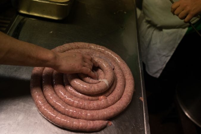 Uncooked Kielbasa sits at Czerw's Polish Kielbasa in Port Richmond. (Branden Eastwood for WHYY)