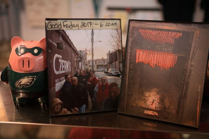 A photo of last year’s Good Friday line outside Czerw's Polish Kielbasa in Port Richmond sits atop the meat counter. (Branden Eastwood for WHYY)