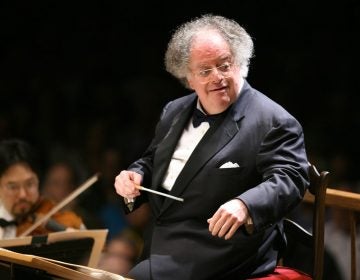 FILE - In this July 7, 2006 file photo, Boston Symphony Orchestra music director James Levine conducts the symphony on its opening night performance at Tanglewood in Lenox, Mass. The Met Opera has fired music director emeritus James Levine, finding 