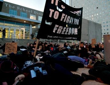 Close to a hundred students and members of the Philadelphia Student Union held a six-minutes 'Die-in' protest on the steps of the School District's North Broad Street headquarters. (Bas Slabbers/for WHYY, file)