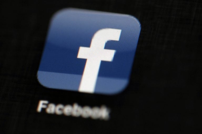 In this May 16, 2012, file photo, the Facebook logo is displayed on an iPad in Philadelphia. Facebook suspended Cambridge Analytica, a data-analysis firm that worked for President Donald Trump's 2016 campaign, over allegations that it held onto improperly obtained user data after telling Facebook it had deleted the information. (Matt Rourke/AP Photo, File)